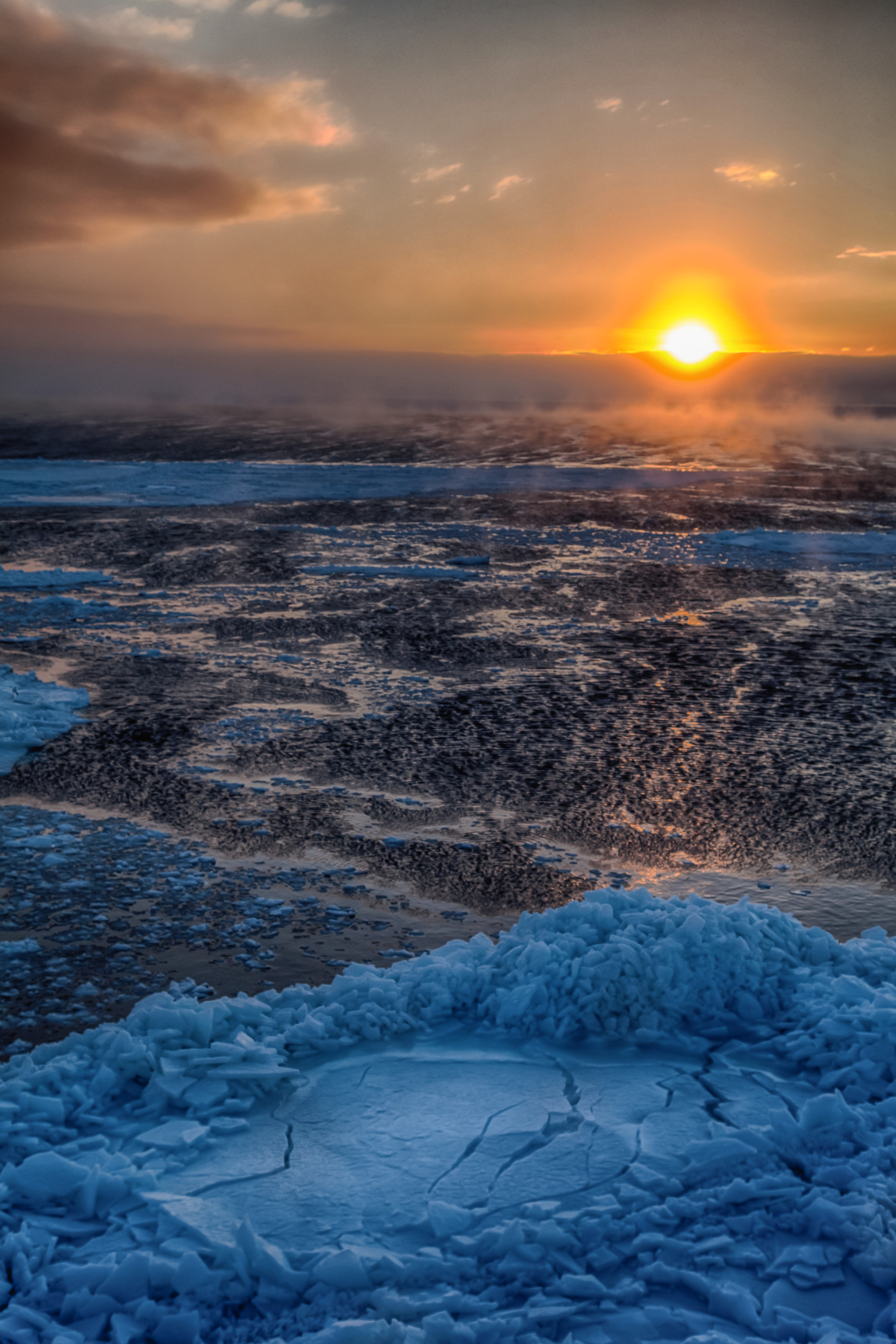 The sun sets behind the sea ice in McMurdo Sound, Antarctica. | Shutterbug